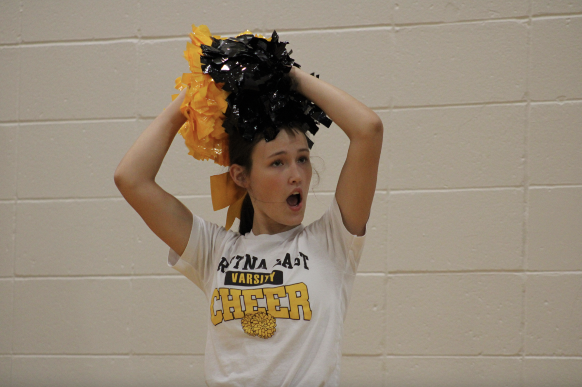 During halftime, Remi Lefeber (10) cheers at the volleyball game.