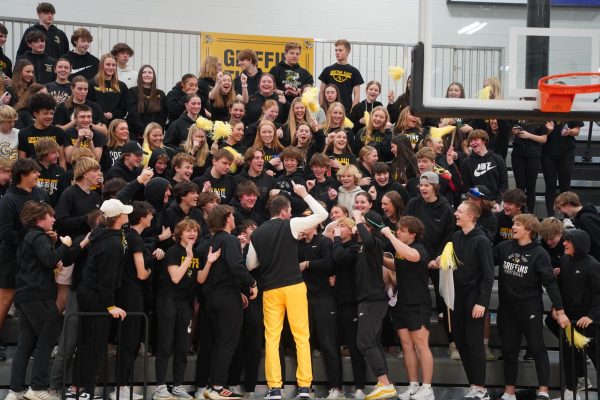 Celebrating the win against Crete on Saturday, head coach Wade Coulter cheers with the student section. 