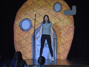 On stage, Zoey Zarling practices her role as Spongebob. Zarling is on the "Sponge" team as the lead. 