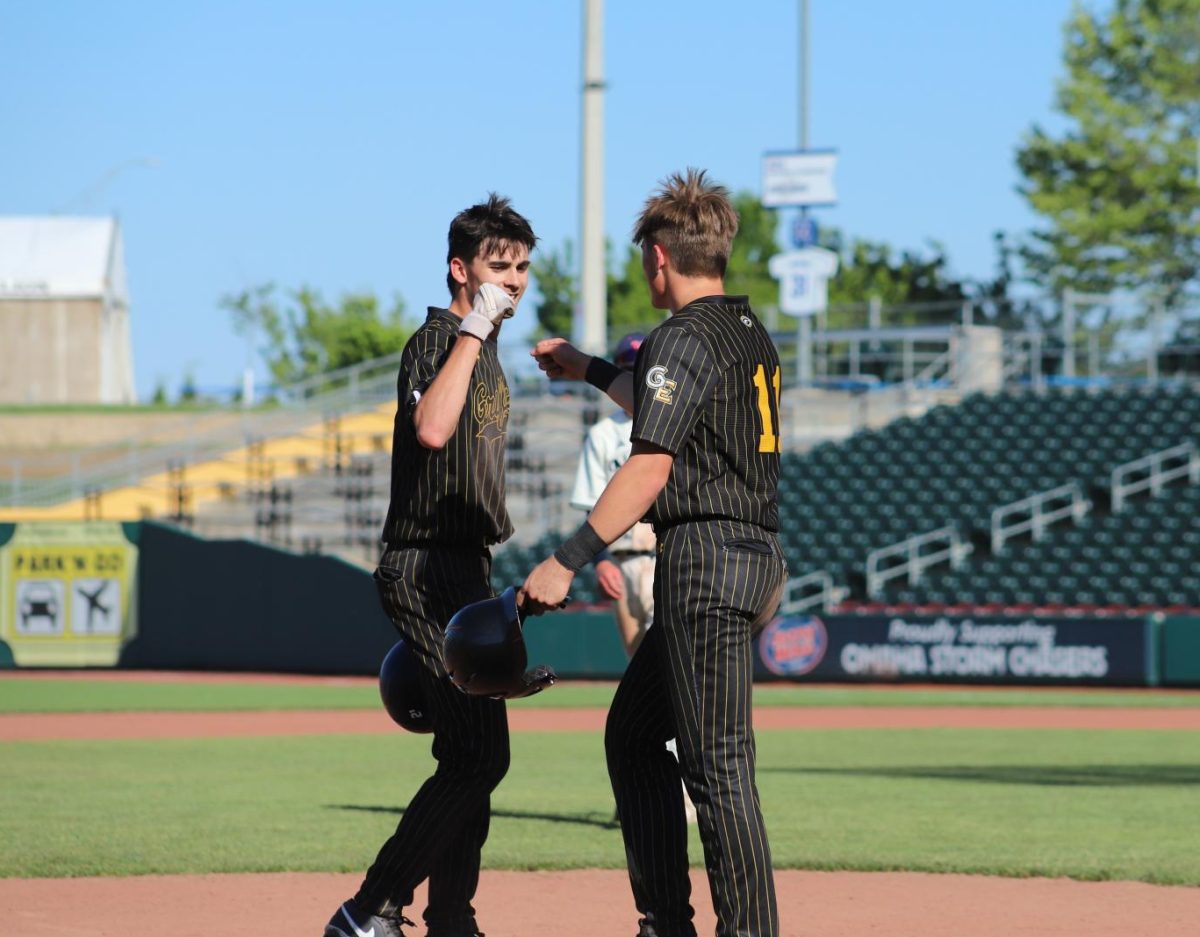 After a double down the line to tie the game, juniors Easton Leahy and Tyler Cox fist bump during a Norris mound visit.