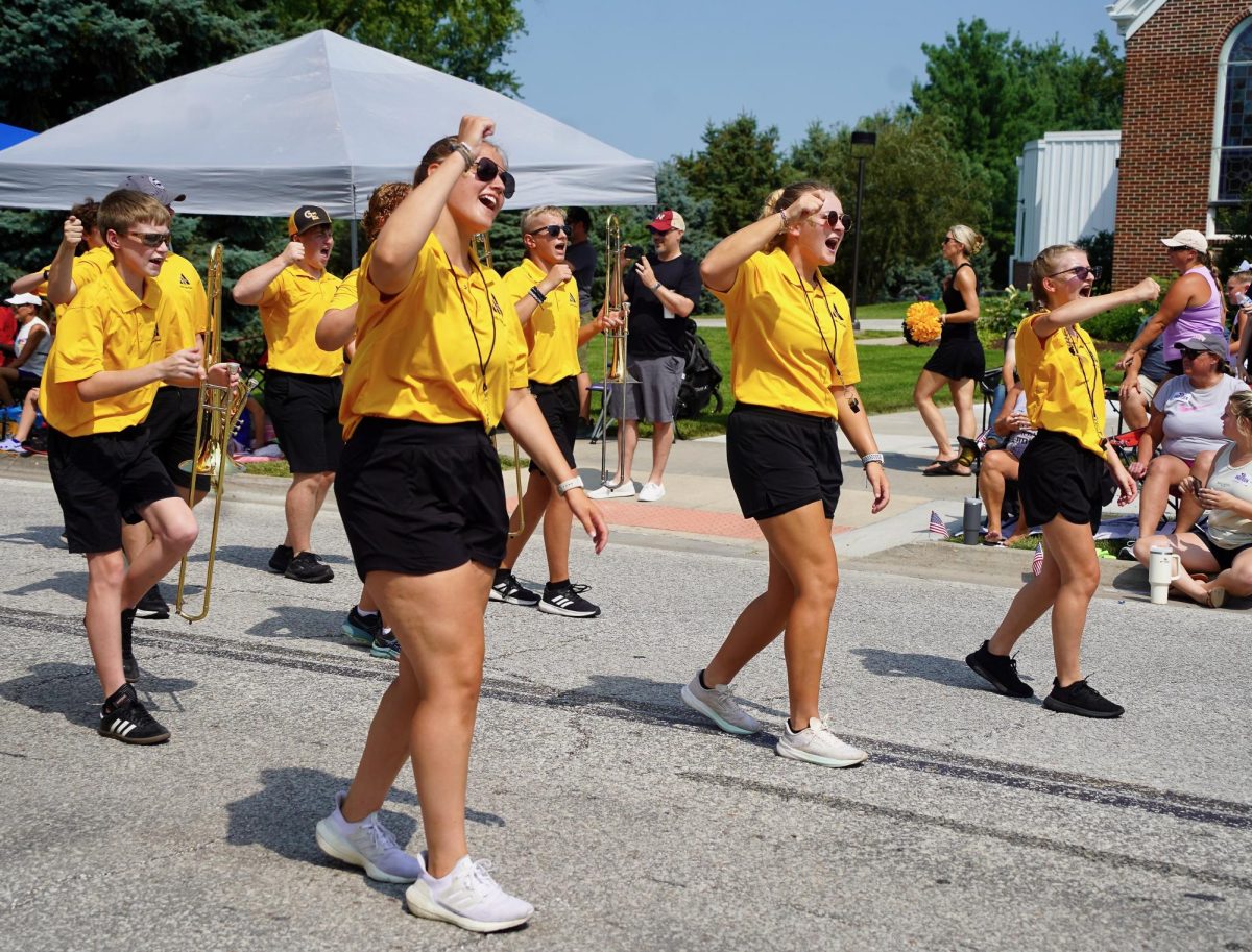 Chanting for GEHS, band leaders seniors Lily Matya and Miranda Menosuek along with junior Akya Kopetzy walk with the marching band. 