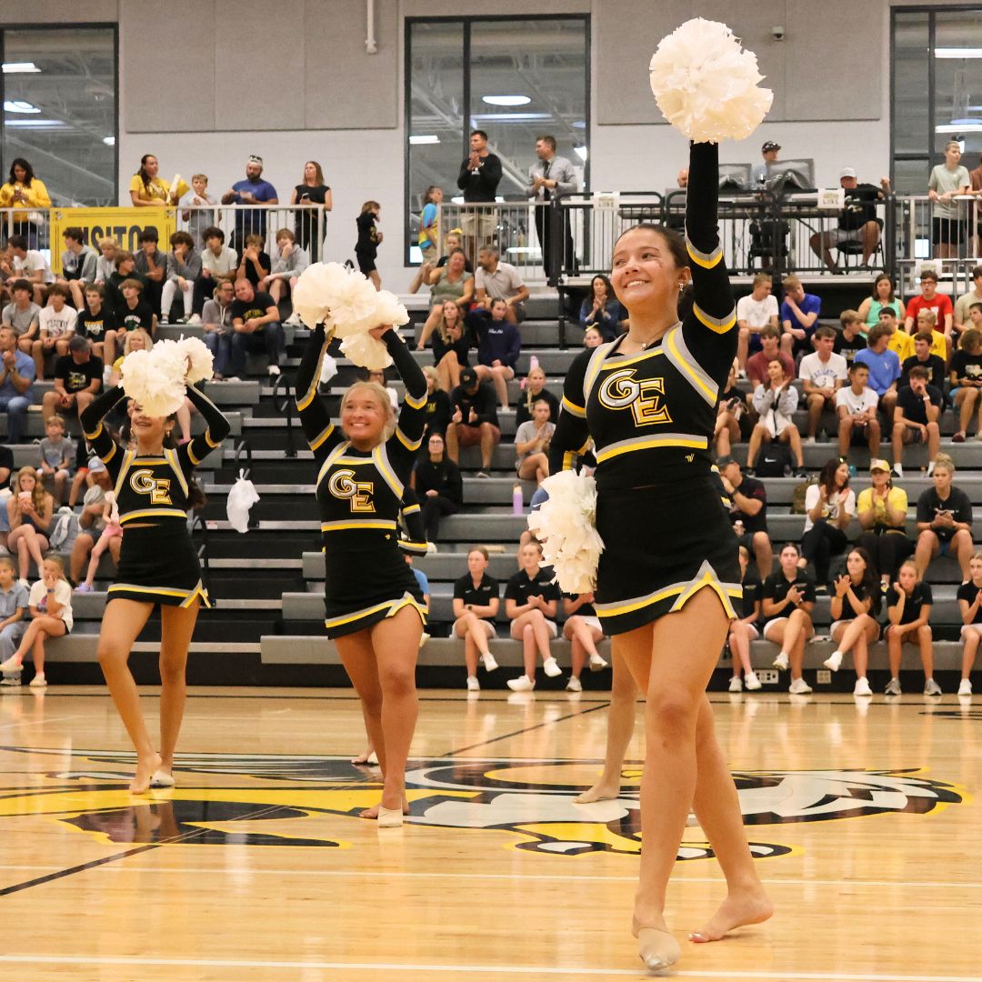 Concluding their performance, junior Sloane Bailey and the rest of the dance team wave into the crowd at the fall pep rally on Aug. 20. The team revealed one of their new performances for their upcoming season.