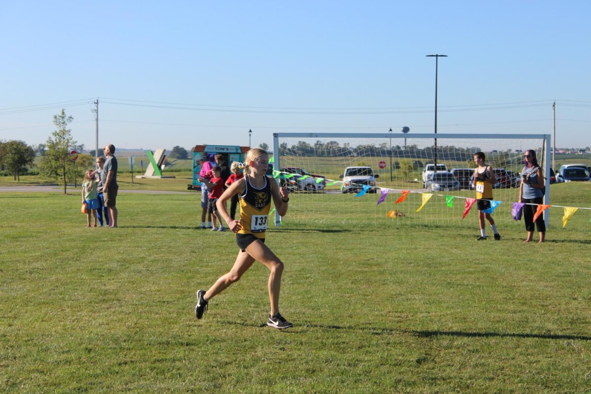 In the final leg of the Aug. 31 girls Gretna Cross Country Invitational, sophomore Avery Visser sprints to the finish line. Visser ended up taking 7th place, ahead of 48 other girls. 