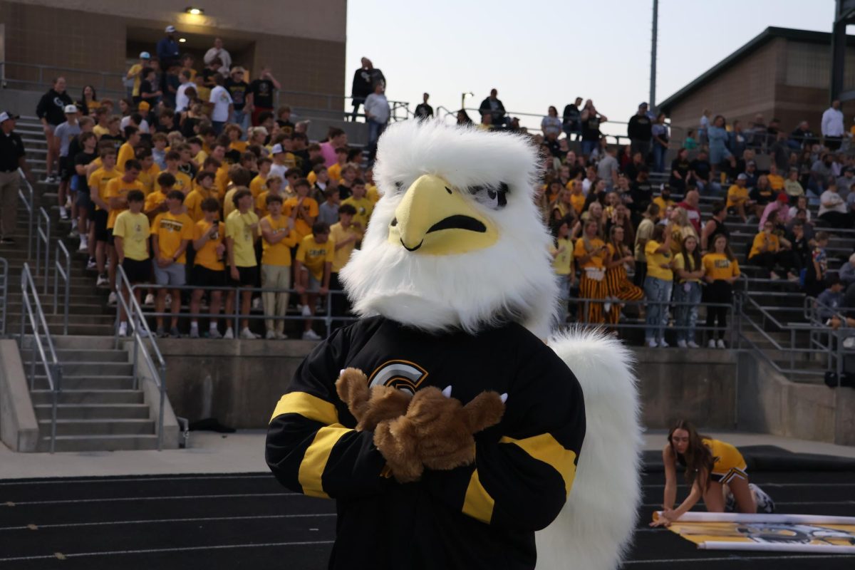 After a positive Griffin play, the Griffin mascot claps on the sidelines of the varsity football game against Ralston on Oct. 10. The game ended in a 51-14 victory for East.