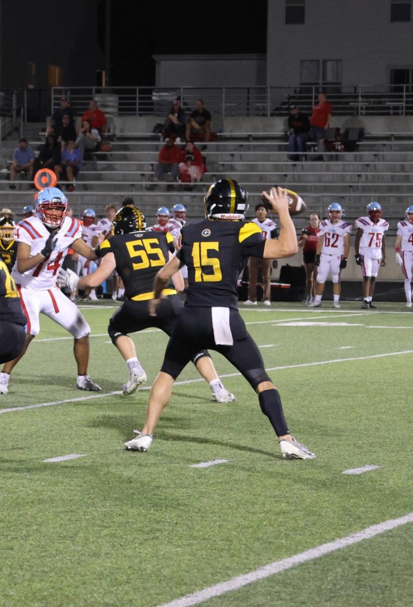 Finding his target, sophomore quarterback Chase Grow slings the rock for a 12 yard gain.