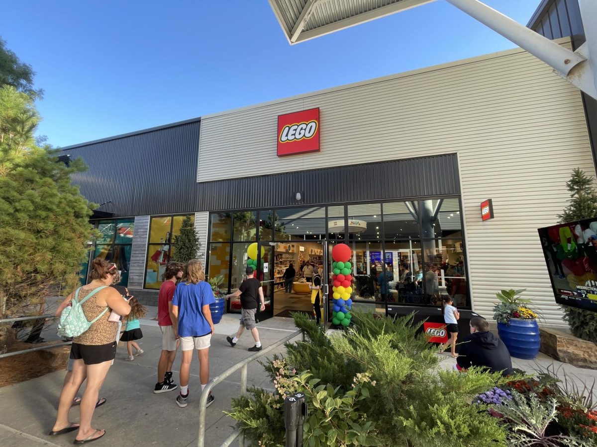 Standing in line, prospective customers wait for their turn to enter the Lego store on Friday, Sept. 20. The store is located between Vineyard Vines and Famous Footwear at the Nebraska Crossing outlet mall. 