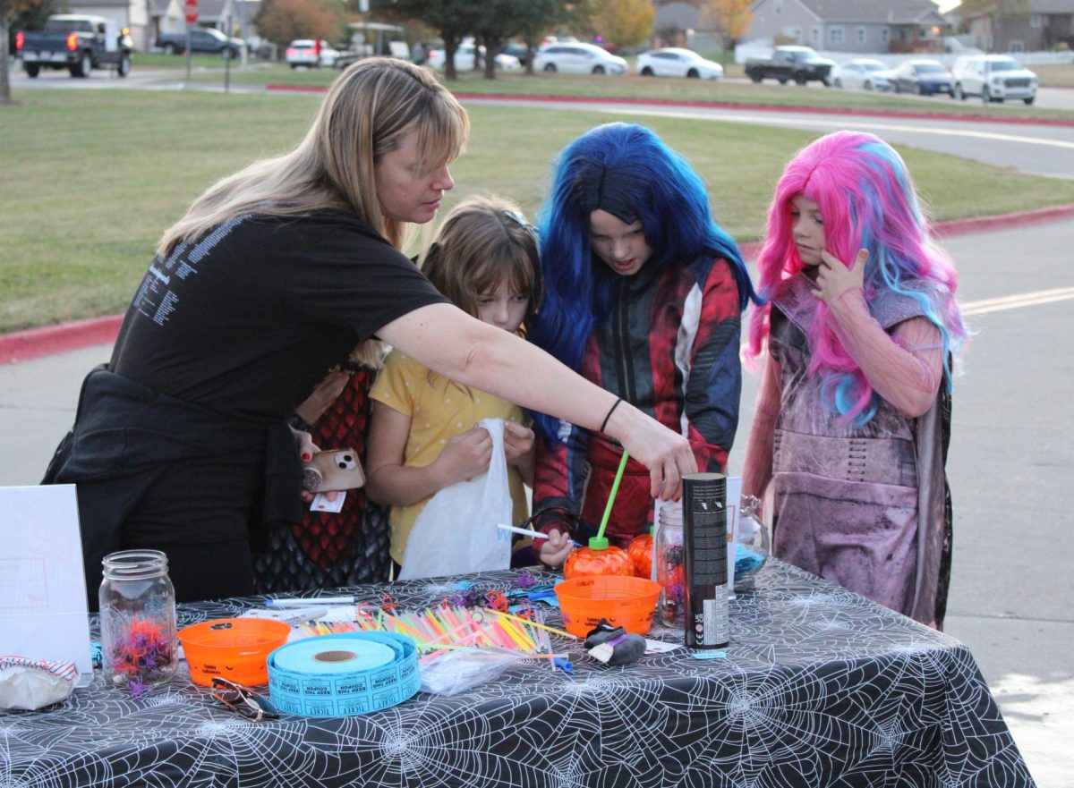 Attendees were able to guess how much candy was in each pumpkin cup in order to win a prize.