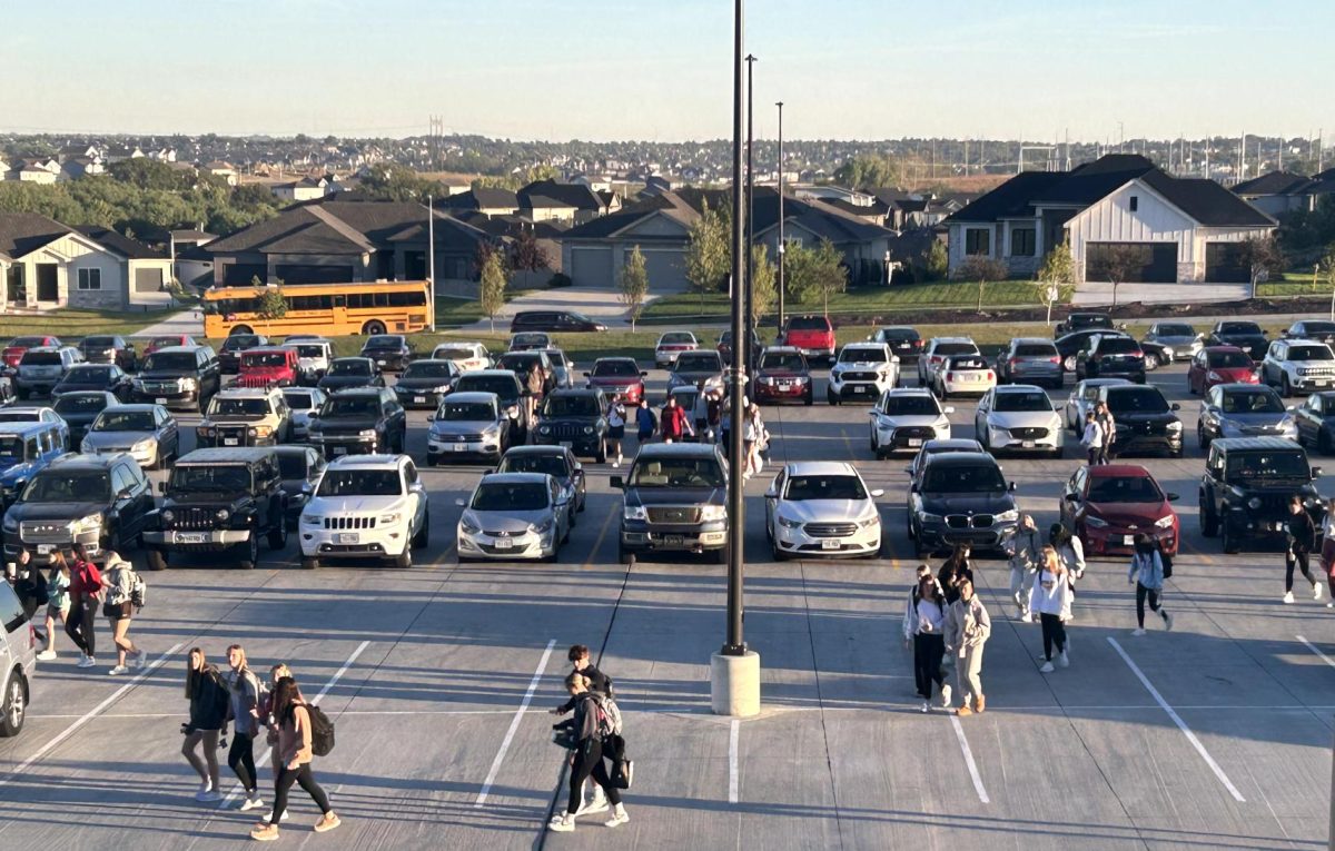 After parking in the student section of the north parking lot, students make their way to their first period classes. 