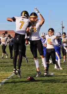 After the first touchdown of the Nov. 1, playoff game against Gering, was made by junior Carson Herrmann, he and senior Carter Lightwine celebrate with a jumping chest bump. The Griffins went on to win the game 44-7, sending them to the Class B quarter-finals. 