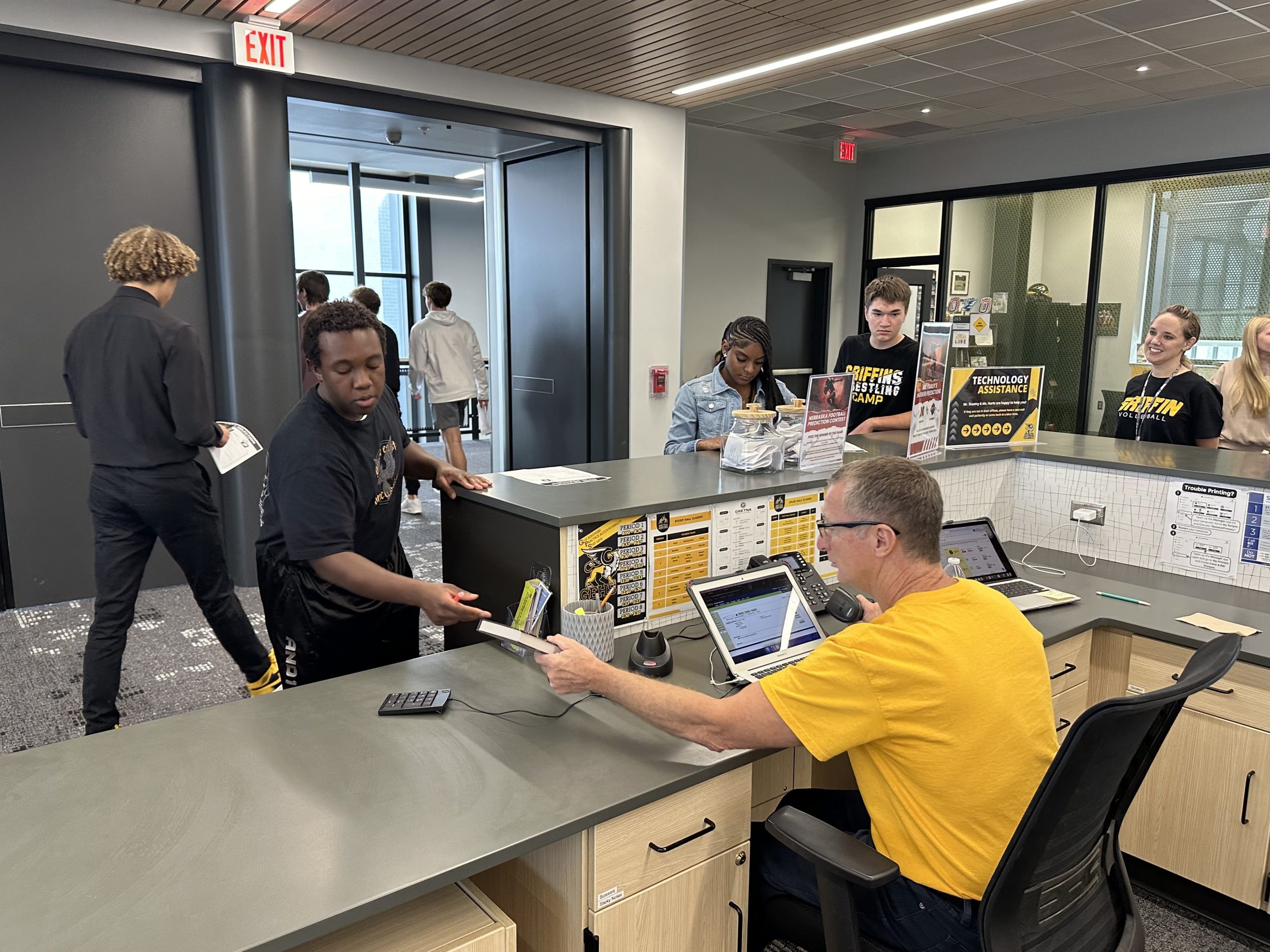 Getting ready to start their new unit in English 10CP, sophomores Timothy White and Jaylimet Lobaina check out dystopian novels during a class visit to the library on Sept. 6. The library staff pulled hundreds of dystopian books and put them on display for the sophomores to choose from.