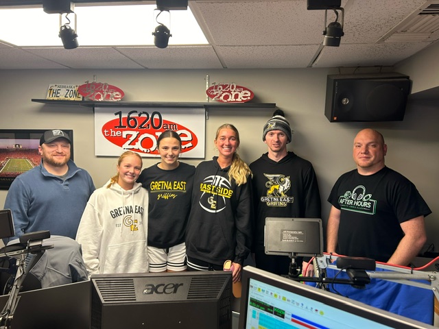 Following their interview on radio station 1620 The Zone's "After Hours" segment, senior basketball players, Addison Larock, Karli Williams and Hailey Levinson and Head Coach Wade Coulter pose for a photo in studio with hosts Jimmie Allen and Jon Schriner.