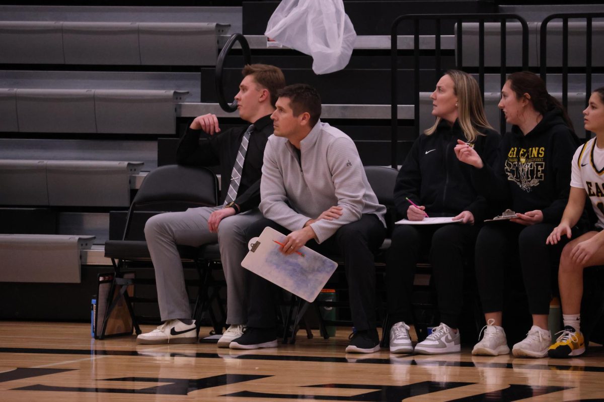 Coach Wes Goranson coaches the basketball team from the bench while winning 23-5.