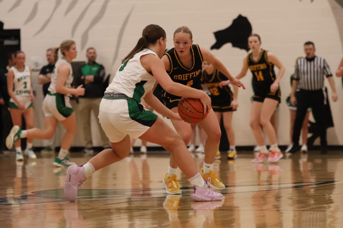 Presuring the ballhandler, Addison Larock (12) prevents the Skutt offense from getting in rythm. 