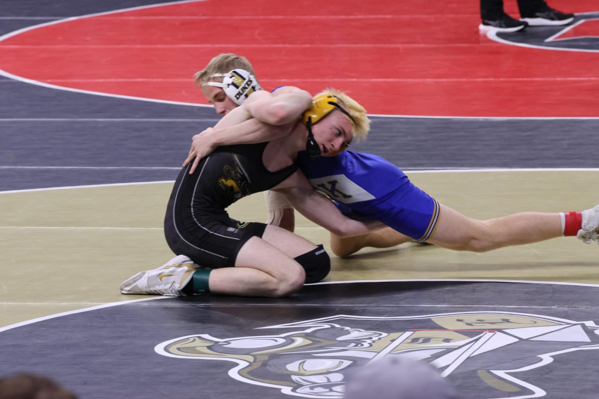 Flipping the tables, junior Ryder Higdon does a move called the Reversal in a match against Colt Eimermann from York High School.