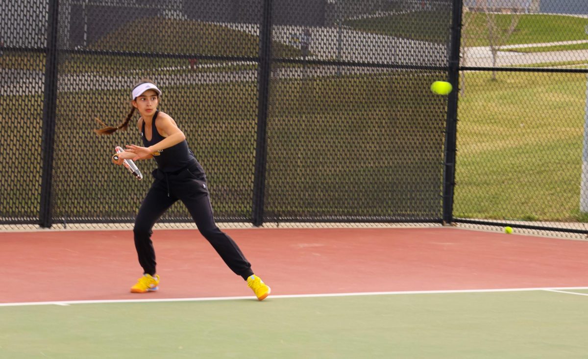 In a match against Pius X, freshman Zoe Katsavelis has her eye on the ball.