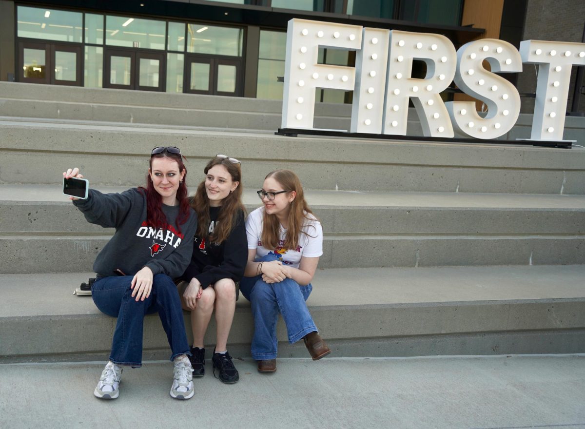 Making sure to capture the "First Seniors" sign, Savannah Lloyd, Brianna Wozniak and Onnika Moore take a selfie. 