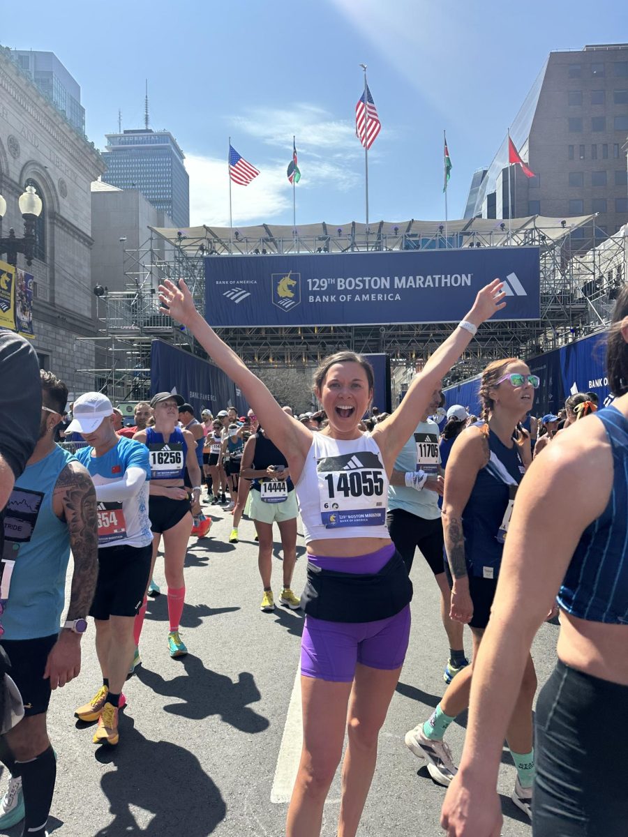Megan Sughroue poses for a photo after the 129th official edition of the Boston Marathon on April 21.