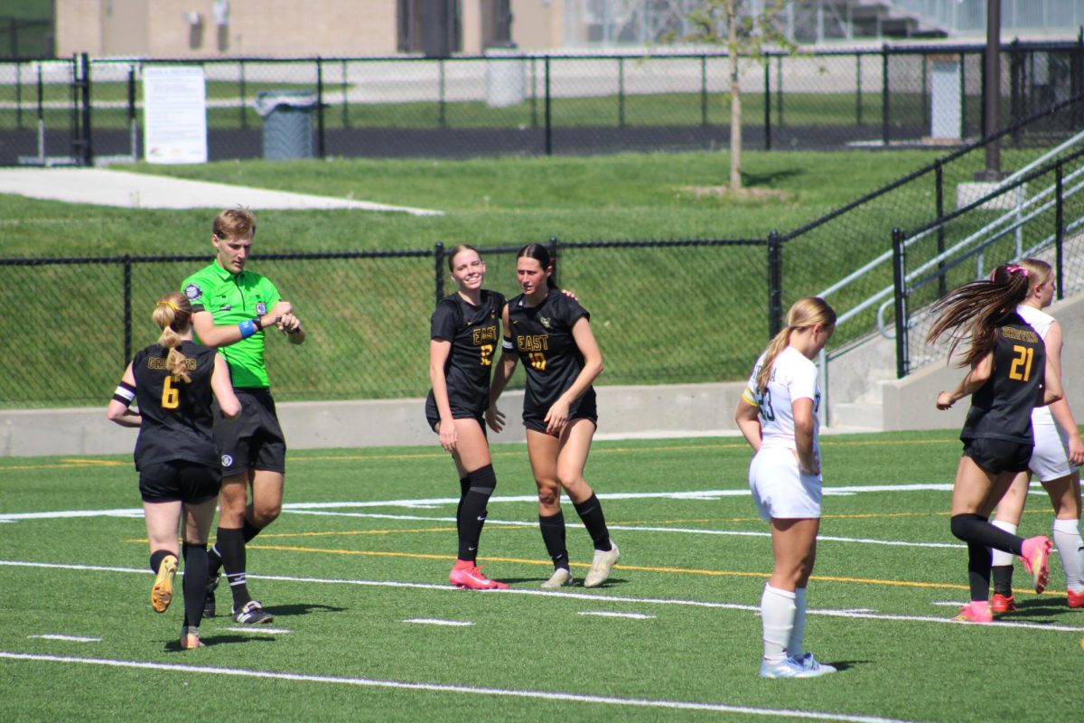 After senior Sonora DeFini scored, senior Kendall Dobberstein embraces her.