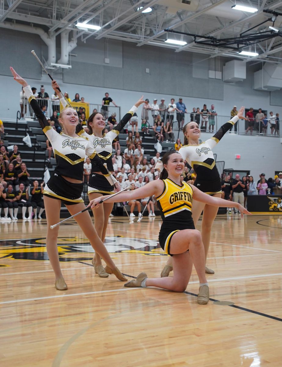 The Gretna East baton twirling team holds a pose at the end of their "Espresso" routine at the Fall Pep Rally on Aug. 22.