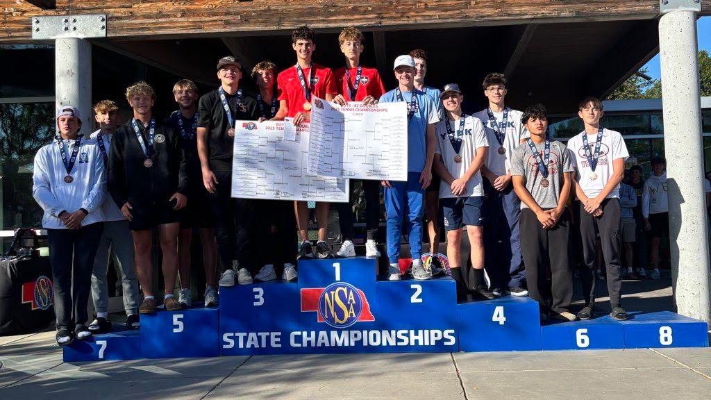 Junior Brayden Jurgensen and sophomore Cooper Williams stand on the podium at State on Oct. 22.