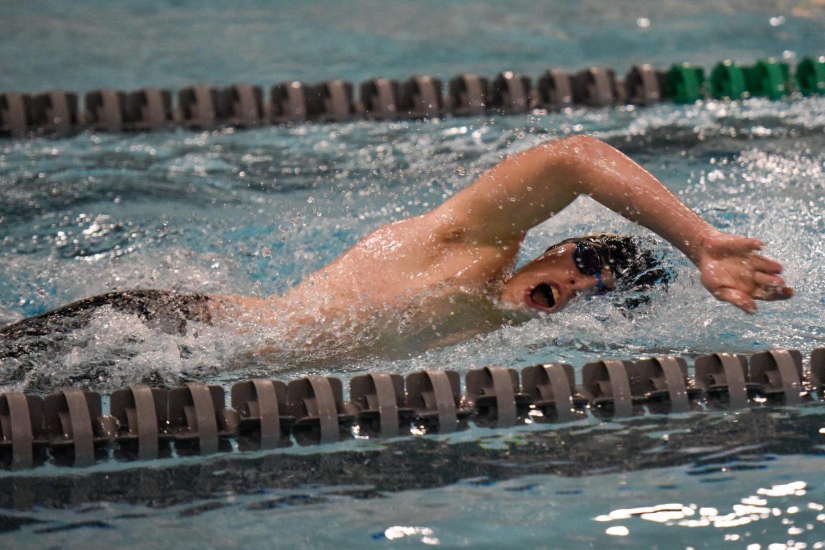 Halfway through a freestyle relay, sophomore Owen Dawson swims back toward his team to tag them in. Dawson finished with the fastest recorded time on his relay team, at 00:27.47.