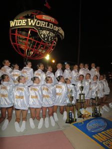 Showing off their coveted national champions jackets, the GEHS dance team poses for a photo with their first place, second place and third place trophies from the 2026 National Dance Team Championships. "I was so excited and proud of us for doing exactly what we wanted to do," senior Carly Drake said. "We moved up a place in both jazz and gameday and we held on to our second place spot in pom. We fought for all of our placements and it was seriously the best day ever."