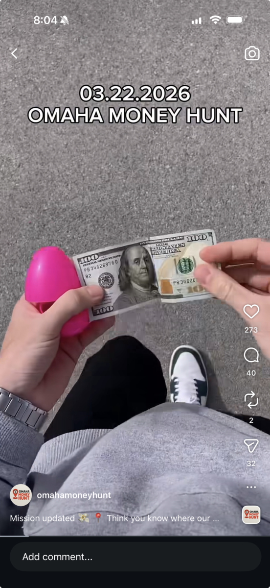 Preparing his "drop" Kyle, the creator of Omaha Money Hunt takes $100 from an Easter egg and puts it in his signature red envelope before hiding it on March 22, while filming a video to post to his social media accounts to alert his followers of his newest hunt. The prize was found that same day at the La Vista Conference Center since it was sponsored by Beautiful Savior Church.