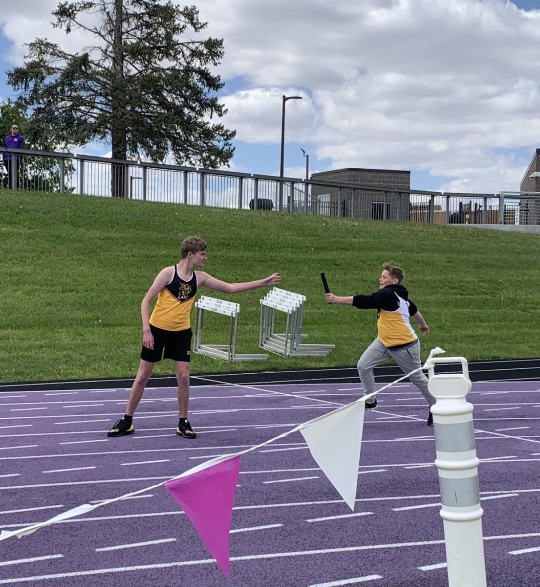 Running the 4x100m during the May 11 unified track meet, freshman parter Jaxen Freyer hands the baton off to sophomore Damon Dauel for the final leg of the race. “The biggest accomplishment this season that made me proud was the camaraderie between the partners and the athletes," unified track coach Zachary Orton said. "That’s what unified track is all about.”