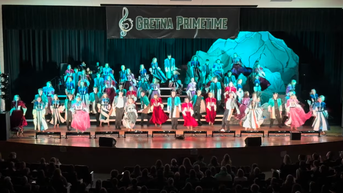 Performing on the Gretna High stage, the Equinox show choir competes in the finals of the Gretna Primetime show choir competition on Jan. 17. Equinox was named Grand Champions and awarded Best Vocals, Best Choreography, and Best Ballad.