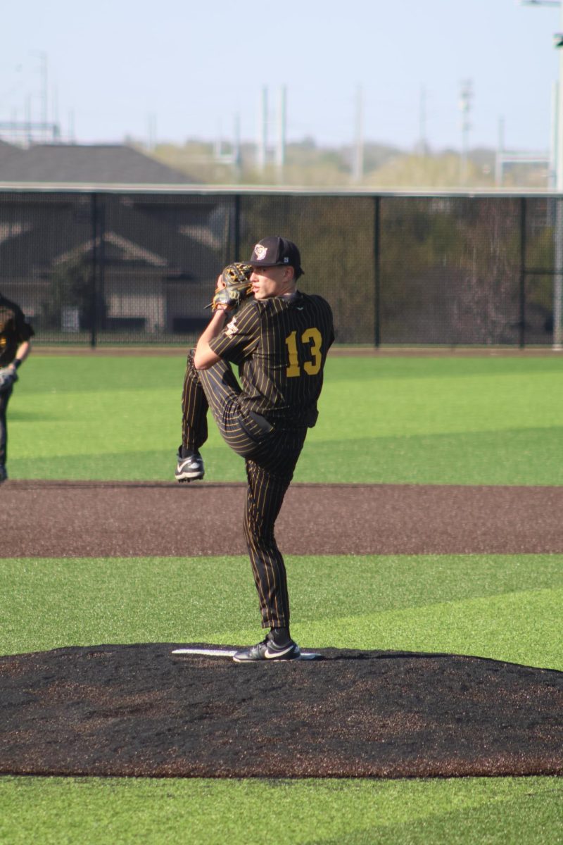 On the mound, pitcher junior Chase Neneman winds up to deliver the final strike of the inning in their April 20 game against the Norris Titans. The Griffins came away from the game with a 3-1 victory.